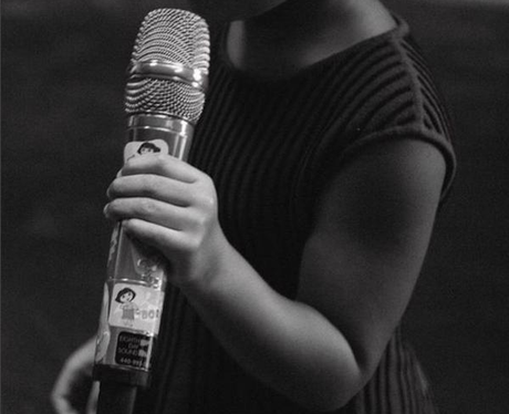 Blue Ivy holding microphone