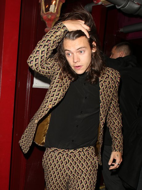 Harry Styles wearing a patterened suit