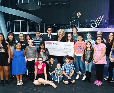 Britney Spears donating cheque to charity