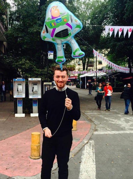 Sam Smith holding a balloon