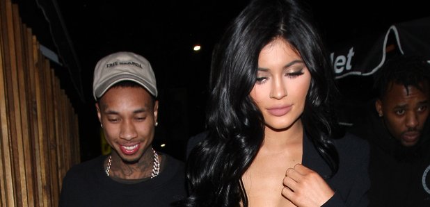 Kylie Jenner in low cut top with Tyga