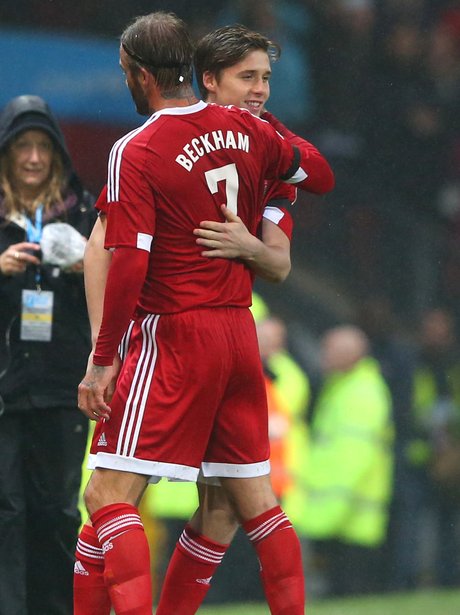 Brooklyn and David Beckham Hug Unicef Football Mat