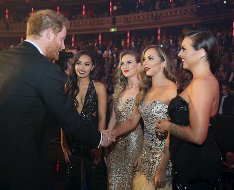Prince Harry greets members of Little Mix after th