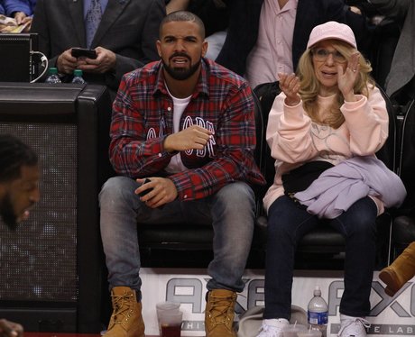 Drake and his mum watching basketball