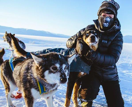 Ellie Goulding in the snow with huskies
