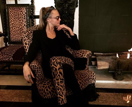 FM Cara Delevingne in leopard print trousers which