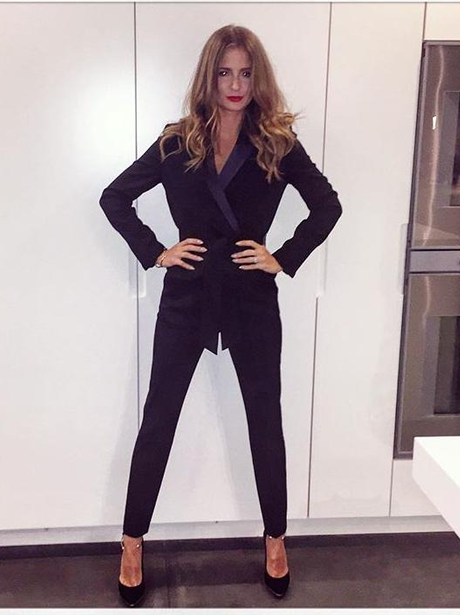 FM Millie Mackintosh in black jumpsuit ahead of fa