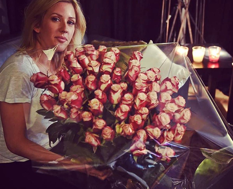 Ellie Goulding poses with HUGE bouquet of flowers