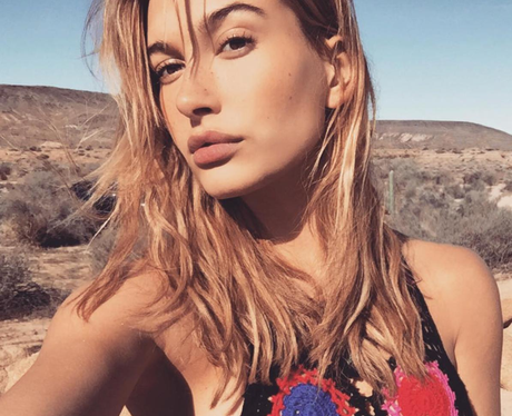 Hailey Baldwin post selfie on set for H&M Coachell
