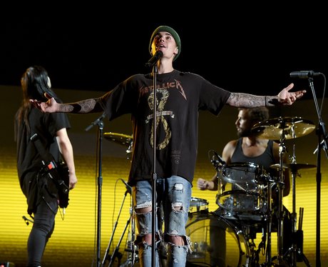 Justin Bieber rehearses onstage during The 58th Grammy's