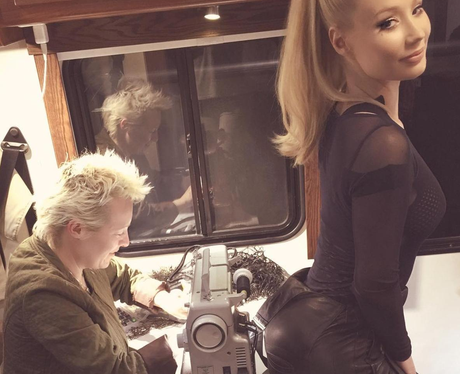 Iggy Azalea has her trousers tailored whilst weari