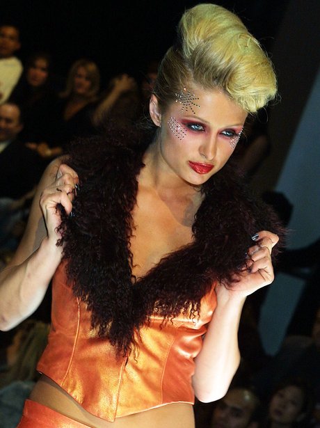 Paris Hilton with big hair during fashion show