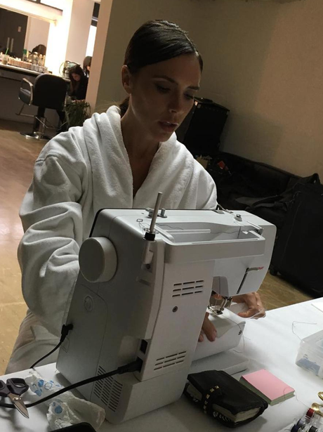Victoria Beckham at a sewing machine
