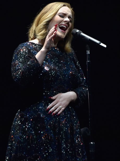Adele wears rings on her wedding finger, sparking
