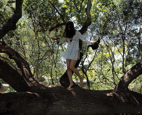 Lilah Parsons in white kimono on holiday