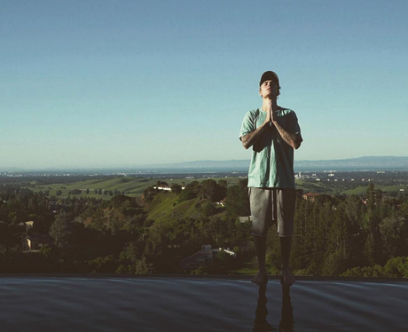 Justin Bieber poses against beautiful backdrop