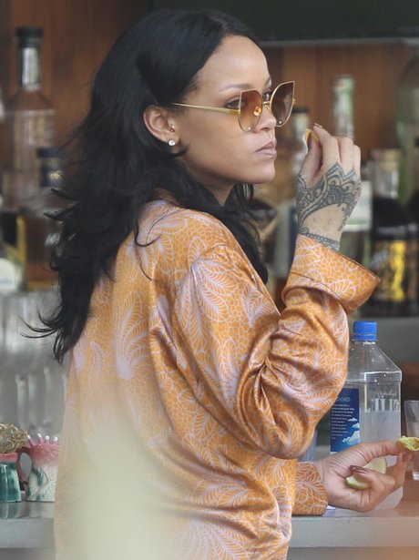 Rihanna chilling out poolside ahead of gig in Miam