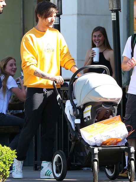 Louis Tomlinson taking Freddie for a stroll