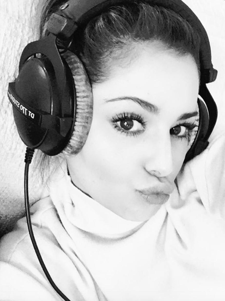 Cheryl teases that she is back in the studio with