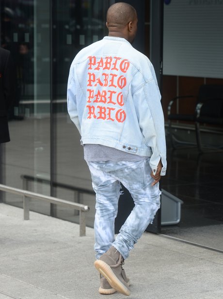 Kanye West steps out in Pablo jacket as he jets ou