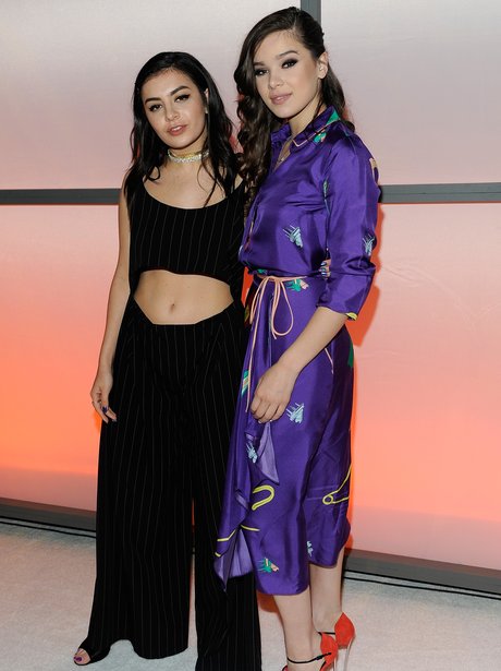Hailee Steinfeld and Charli XCX cosy up at music a