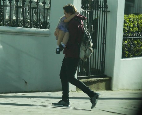 Brooklyn Beckham carries Harper