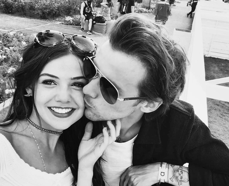 Danielle Campbell and Louis Tomlinson cosy up in r