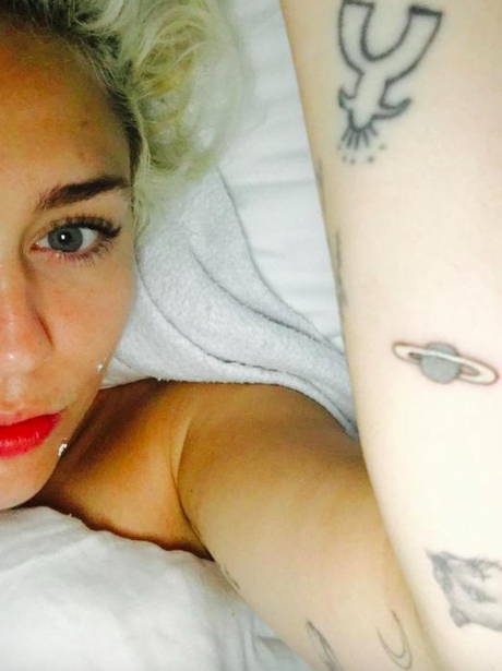 Miley Cyrus new 'Jupiter' planet arm tattoo