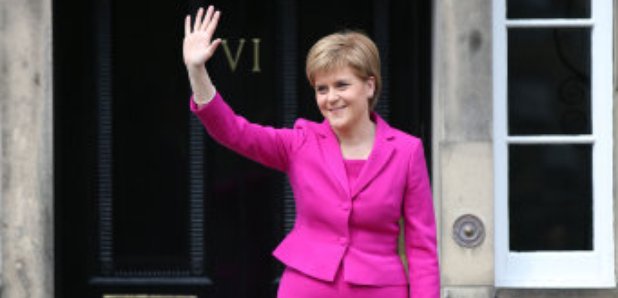 Nicola Sturgeon waves from the steps of Bute House