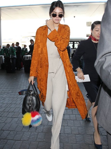 Kendall Jenner in knitted outfit with orange kimon