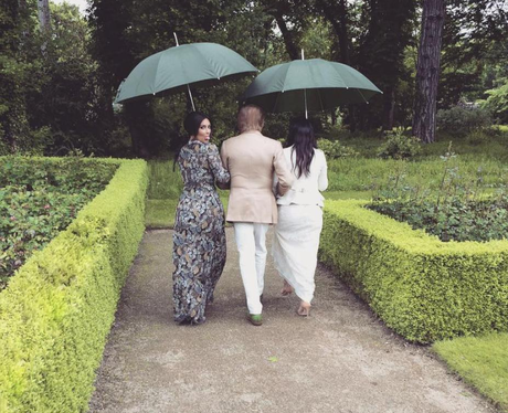 Kim and Kourtney Kardashian walk with Valentino on