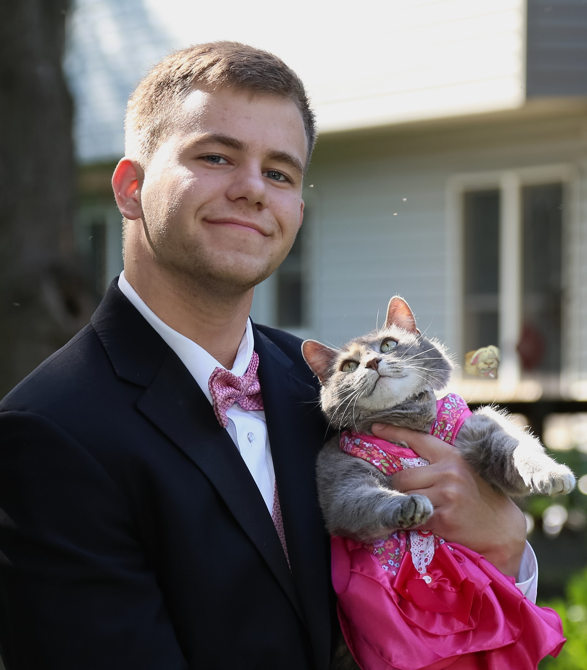 Guy takes his cat to prom