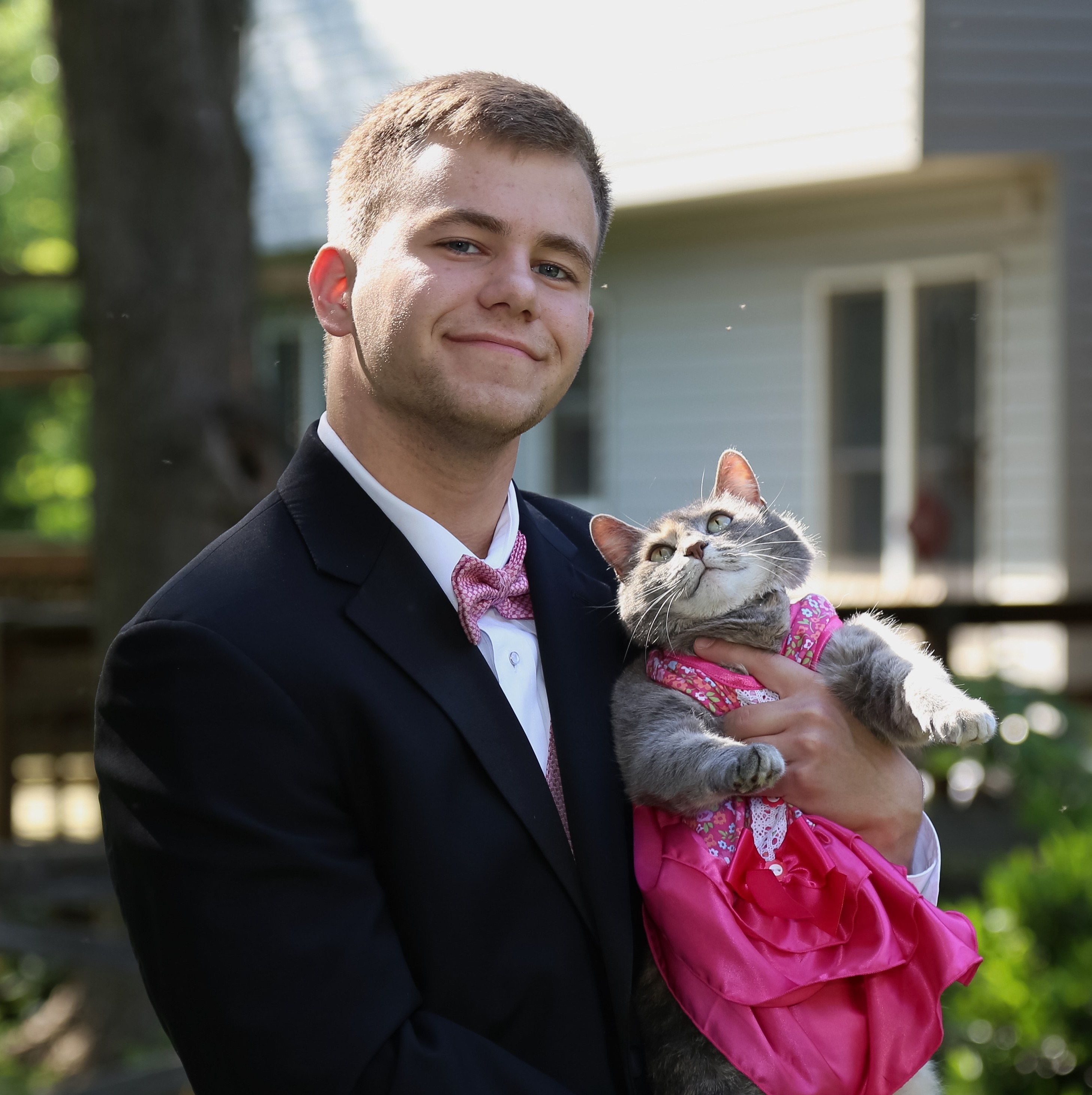 Guy takes his cat to prom