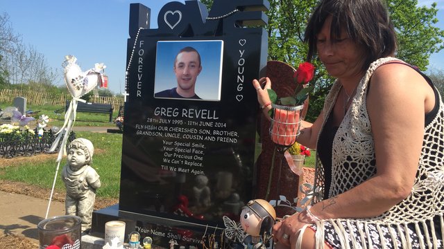 Karen Revell at Greg Revell's grave in Derbyshire