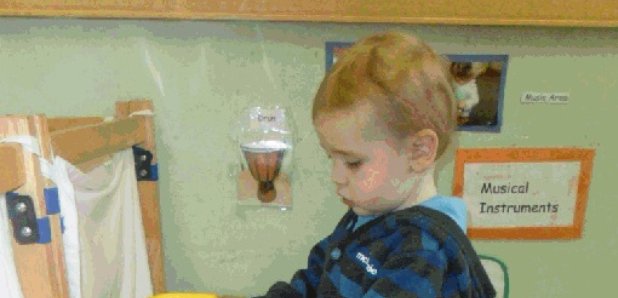 Liam Fee playing at nursery