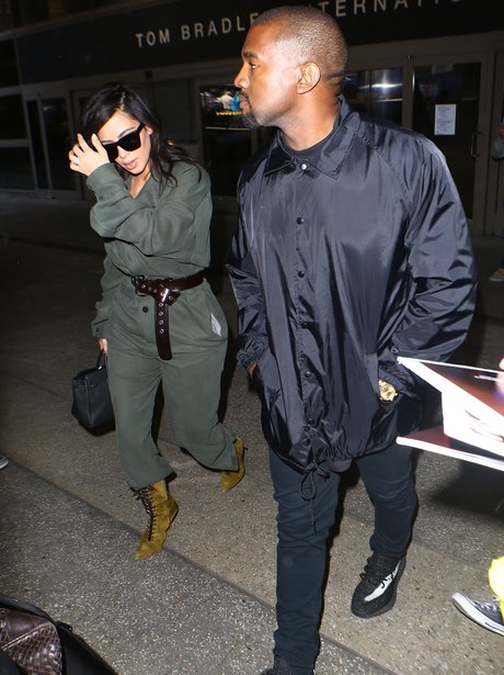 Kim and Kanye arrive back into LA airport after ce