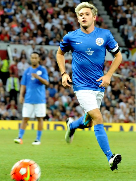 Niall Horan playing football with SoccerAid