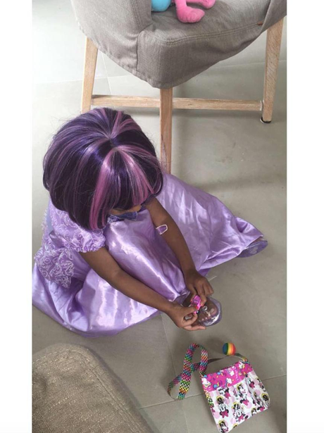 North West wears purple wig