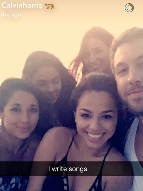 Calvin Harris poses with a group of girls