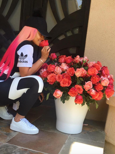Blac Chyna smells the roses