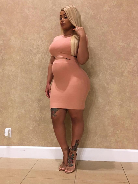 Blac Chyna shows off baby bump in body con dress