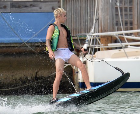 Justin Bieber wears white boxer shorts whilst surfboarding... and they