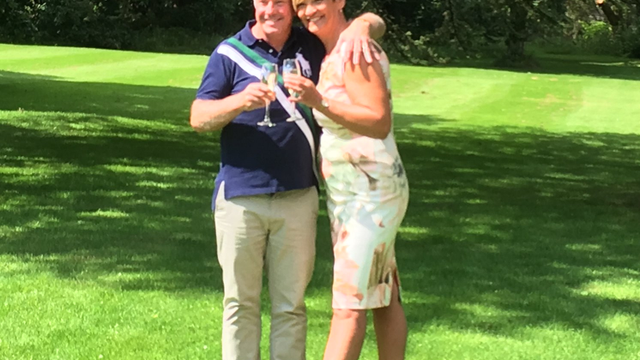 couple celebrating lottery win with champange