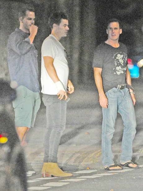 Harry Styles sports a bandage on his wrist during