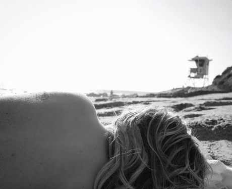 Chloe Grace Moretz goes topless on the beach