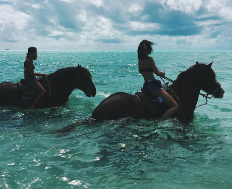 Kendall Jenner rides horses through the sea