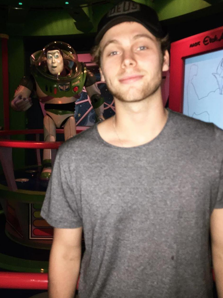 Luke Hemmings poses with Buzz Lightyear
