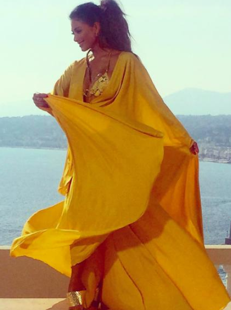nicole scherzinger poses in flowing dress