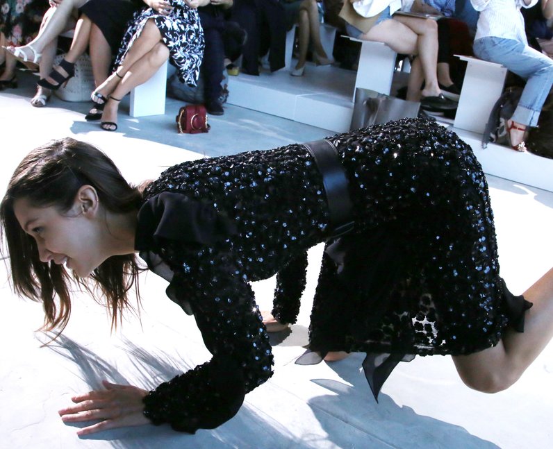 Bella Hadid falls over during Michael Kors runway