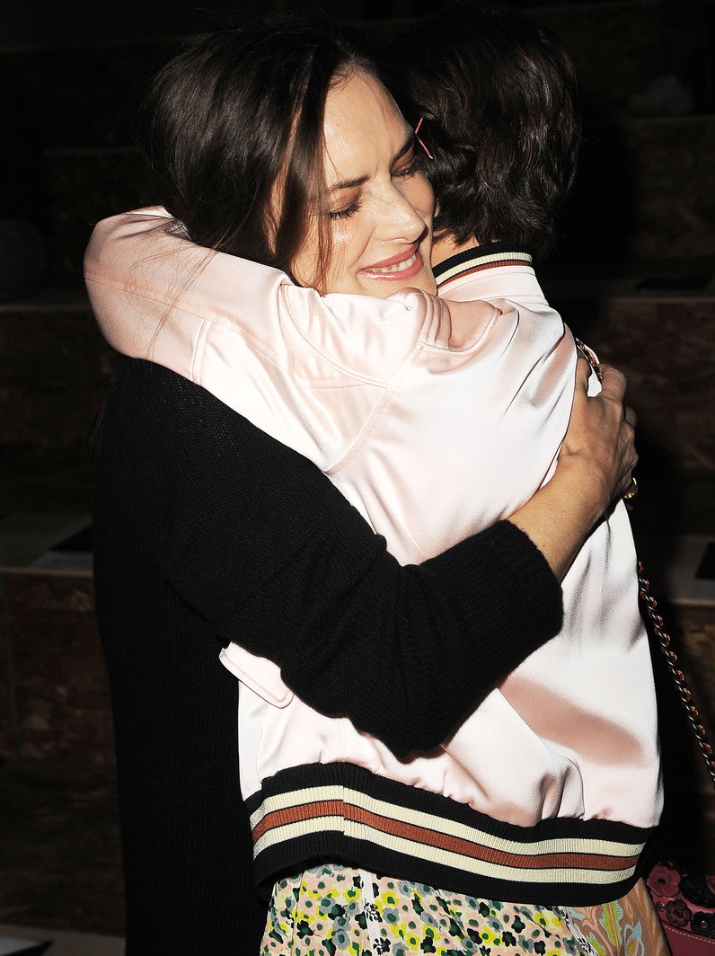 Millie Bobby Brown hugs co-star Winona Ryder at Co